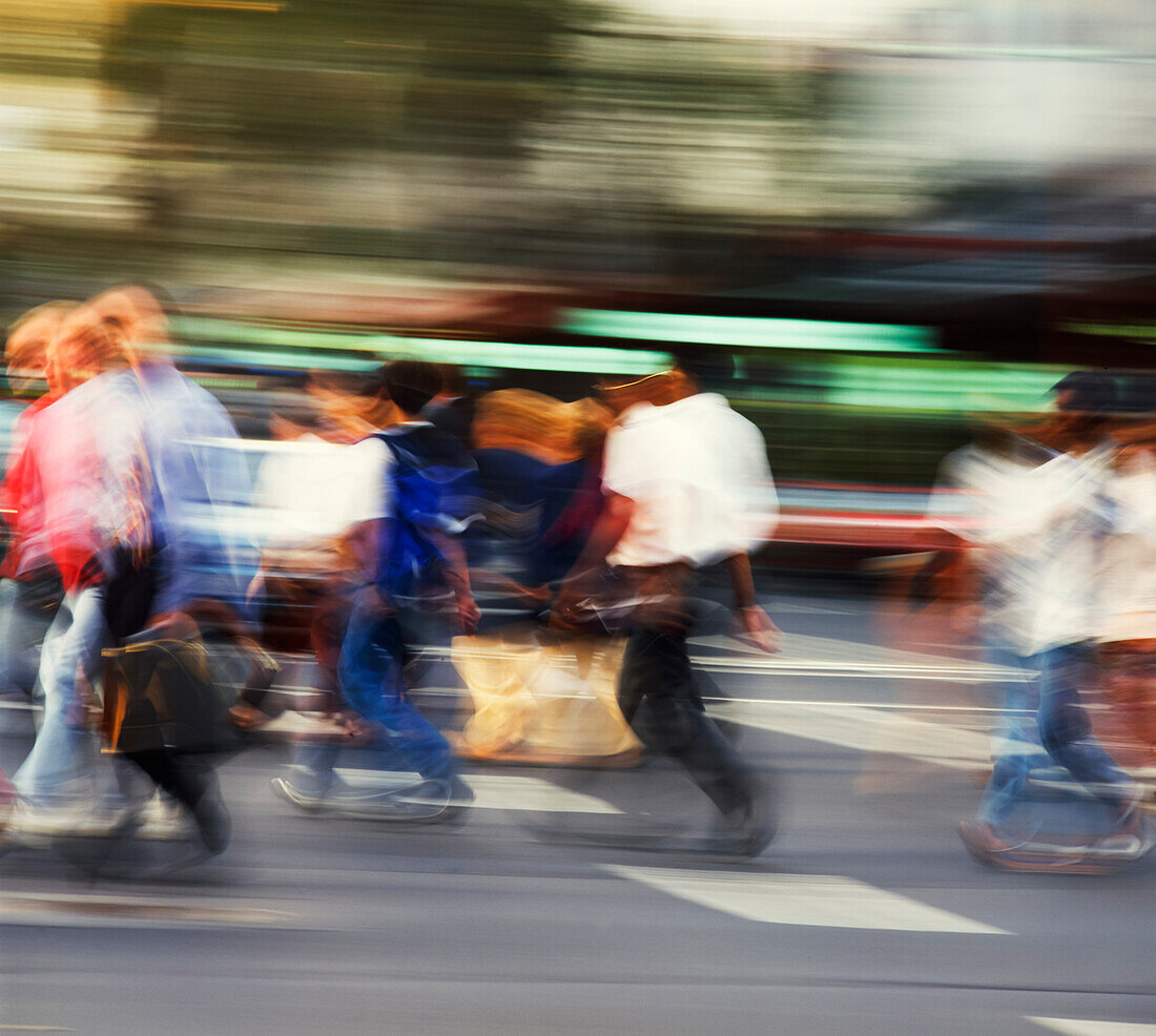 People crossing intersection on city street