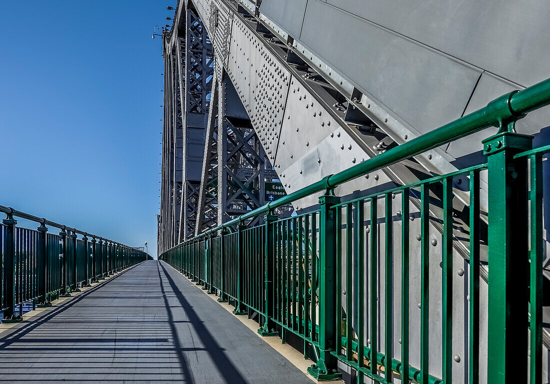 Walkway on Storey Bridge against blue sky