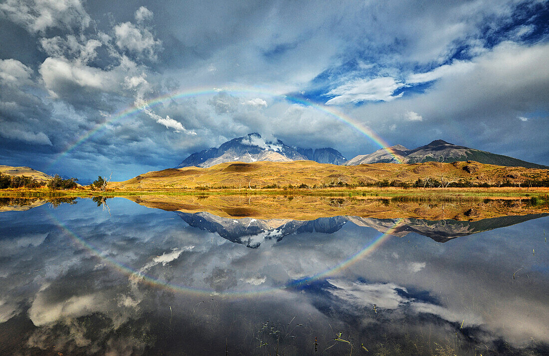 Rainbow in Patagonia, reflection in a lake