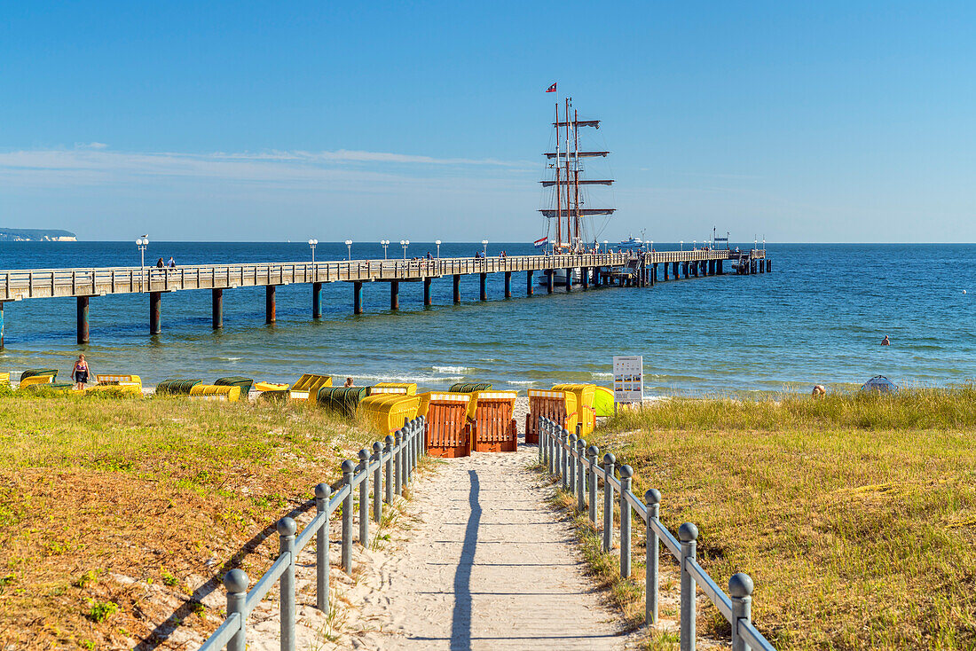Beach, pier and sailing ship in front of the Baltic Sea resort of Binz, Rügen Island, Mecklenburg-West Pomerania, Germany