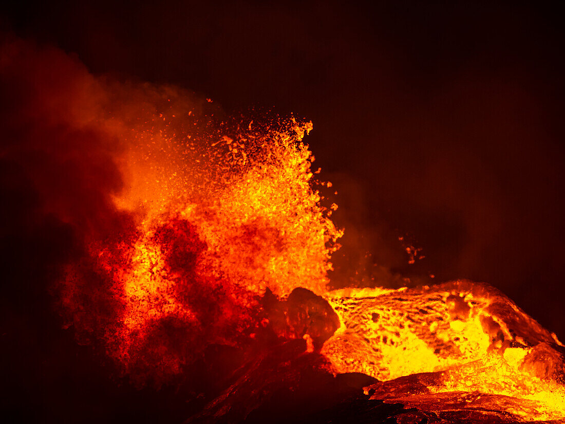 Red hot magma and gas cloud, eruption at night, Fagradalsfjall Volcano from Observation Hill, Iceland
