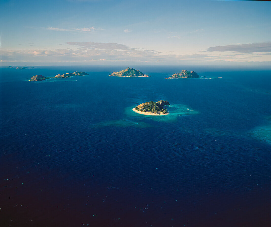 Aerial of a group of Pacific Atolls - part of the Fiji Island Group