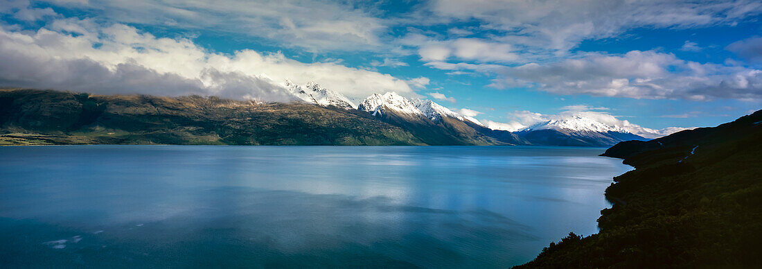 Snow capped Southern Alps on the edge of Lake Wakatipu