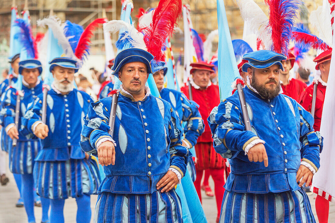 Participants in Calcio Storico Fiorentino festival on parade, Piazza della Signoria, Florence, Tuscany, Italy