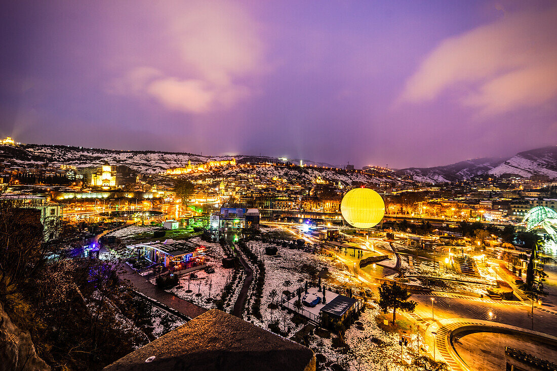 Evening view of Tbilisi's Old town with unusual heave snow