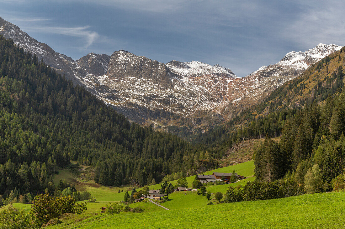 Valley in the Alps with farm, Brenner, Bolzano, South Tyrol, Italy. waterfall path.