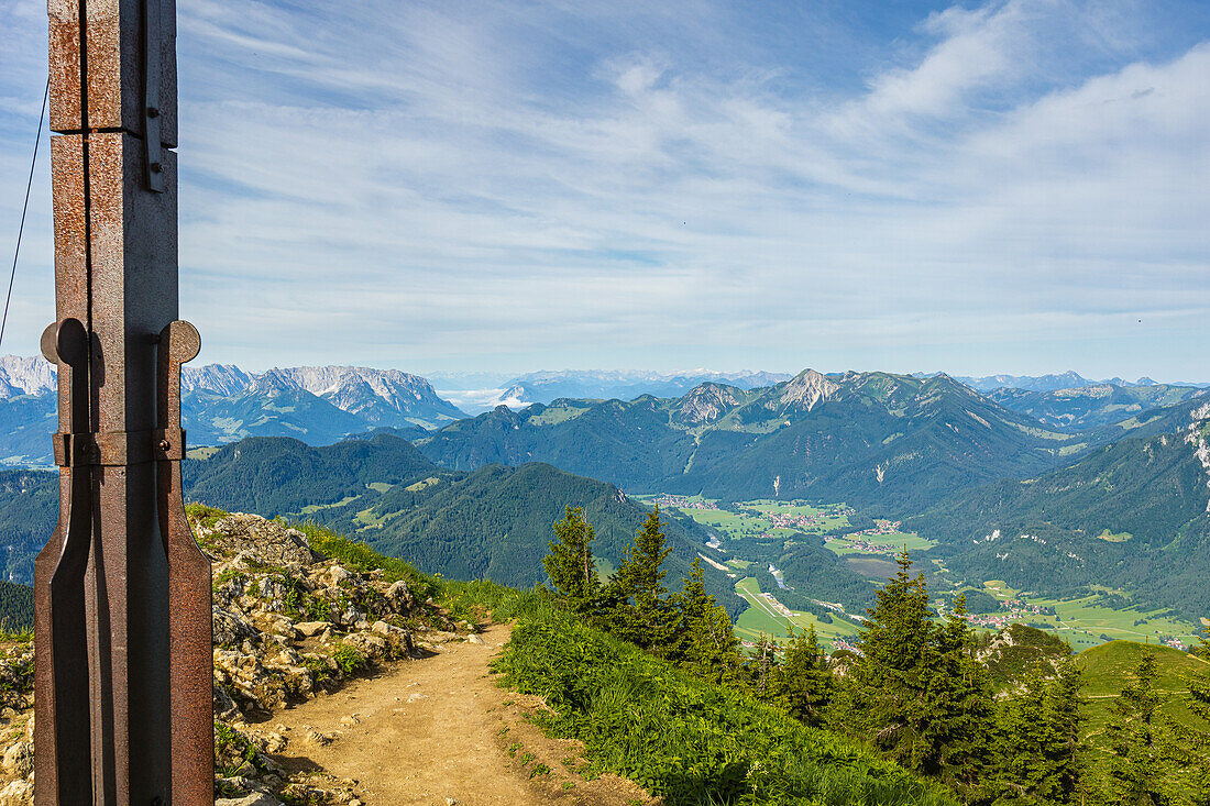 View of the Eastern Alps from the summit of the Hochgern. In the foreground you can see the summit cross. Marquartstein, Chiemgau Alps, Upper Bavaria, Bavaria, Germany