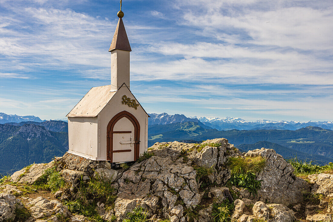 Small chapel at the summit of the Hochgerns in summer, with light clouds. deserted. Marquartstein, Chiemgau Alps, Eastern Alps, Upper Bavaria, Bavaria, Germany, Europe