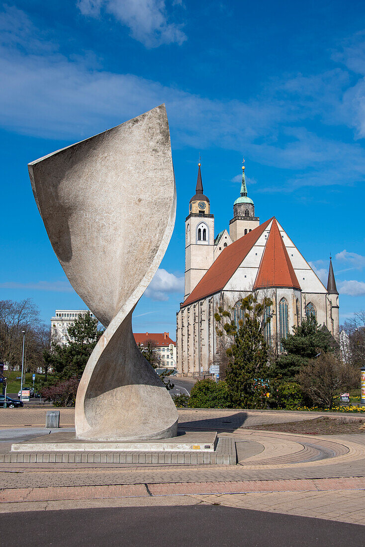 Flag monument, behind it the Johanniskirche, Magdeburg, Saxony-Anhalt, Germany