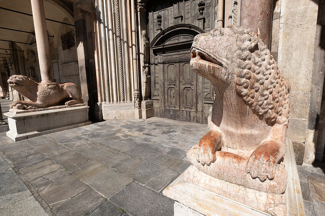 View of the two columnar lions of the Duomo in the Piazza del Comune, Cremona, Lombardy, Italy, Europe