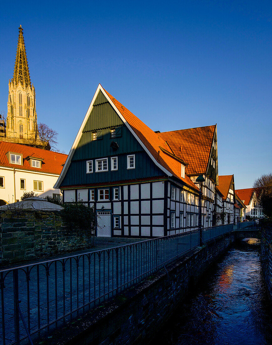 Houses of the tanners at Loerbach in Soest and tower of the church St. Maria zur Wiese, North Rhine-Westphalia, Germany