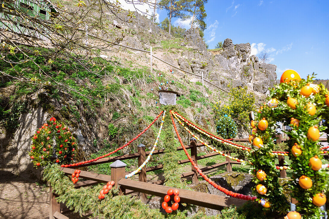 Easter spring decorated with colorful Easter eggs at the Trubachquelle in Obertrubach in Franconian Switzerland, Bavaria, Germany