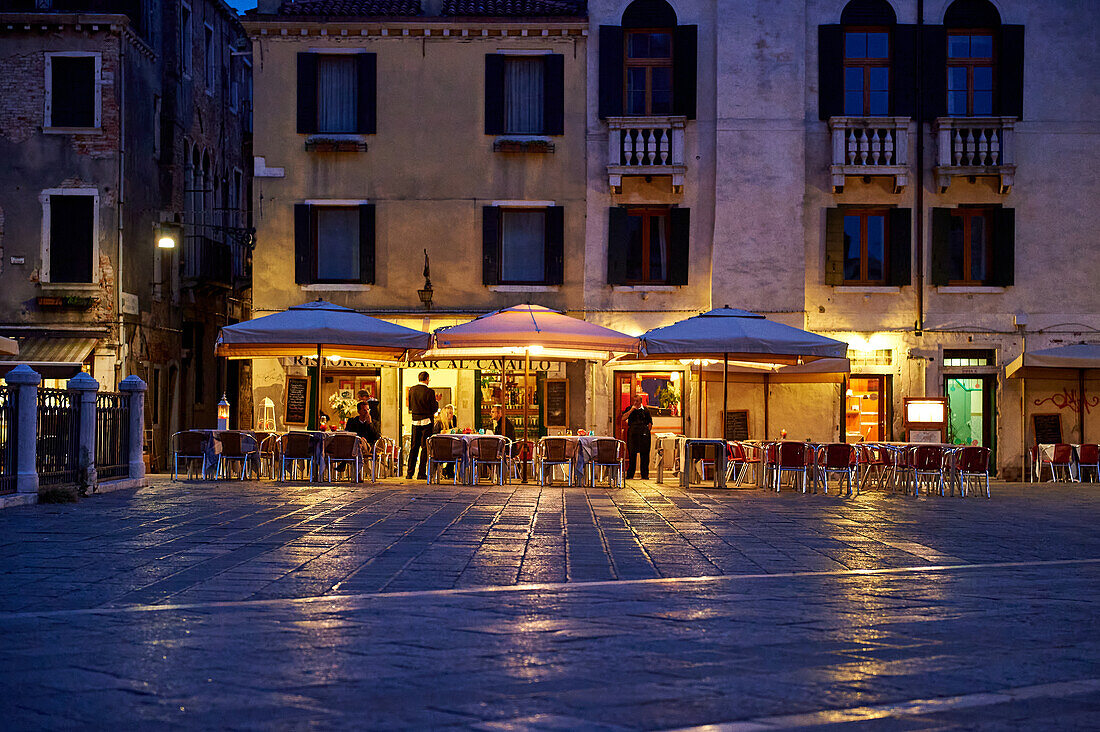 Evening view of the Ristorante / Bar Al Cavallo from Campo Santi Giovanni e Paolo, Venice, Italy, Europe