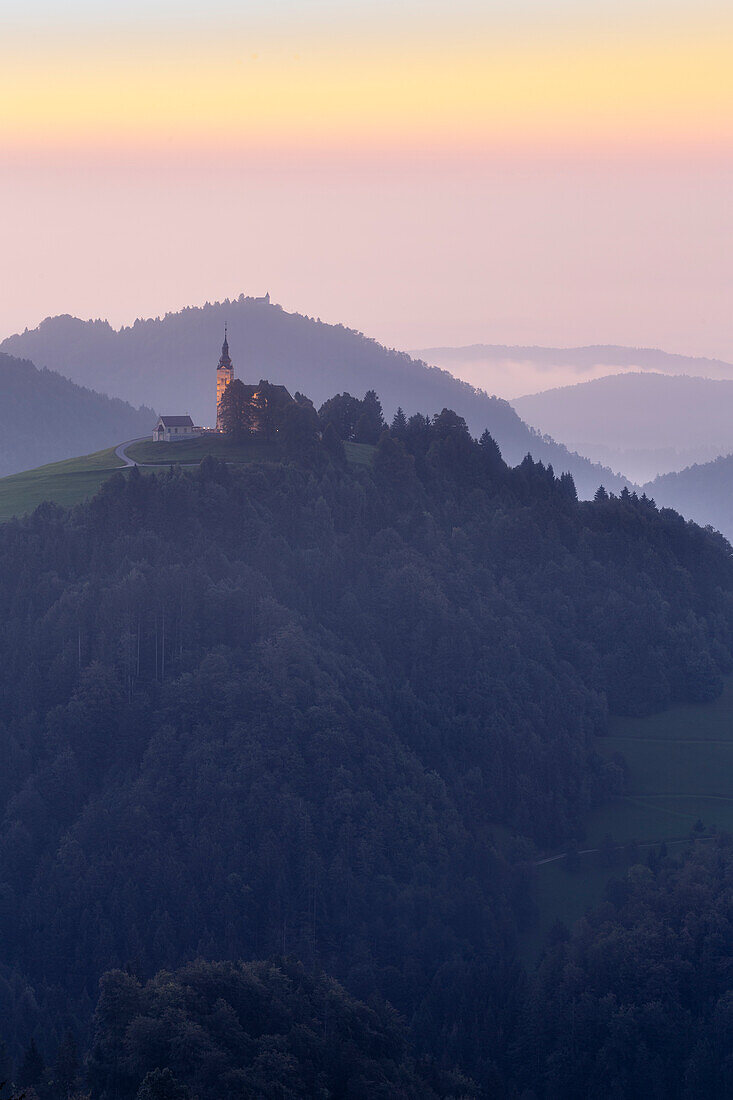 Church Zupnijska cerkev sv. Lenarta on mountain, in Dobrova-Polhov Gradec, Škofja Loka, Slovenia. Dawn