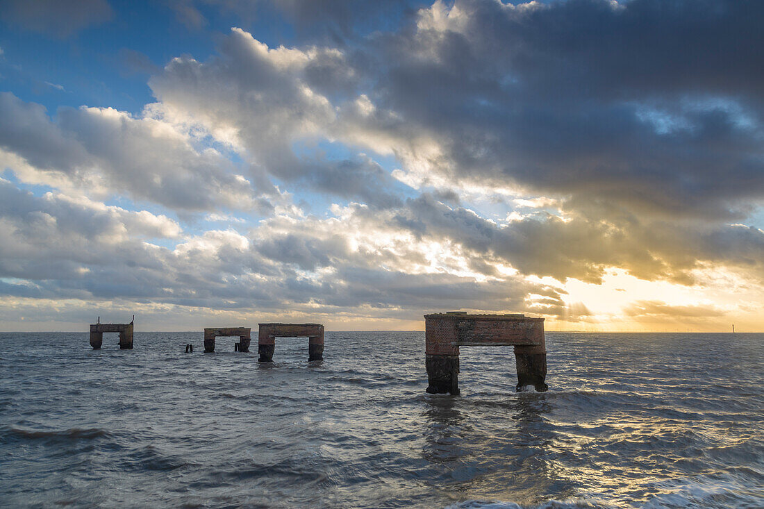 Old ferry dock, high tide, sunset.Eckwarderhörne, Butjadingen, Lower Saxony, Germany.