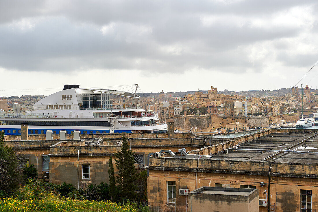 A cruise ship amidst the old town of Valletta, Malta, Europe