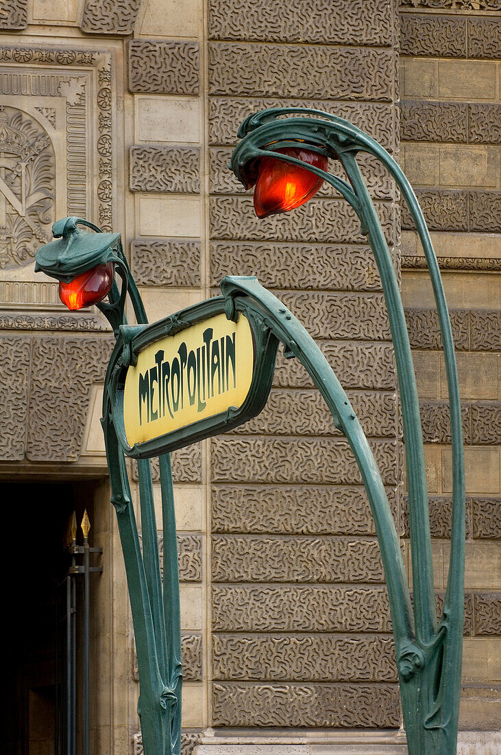 Art Deco Metro Sign and lights by the Louvre, Paris, France