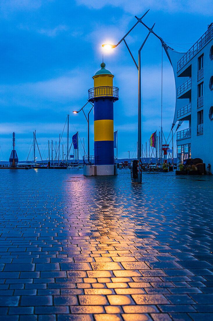 Old lighthouse in yellow and blue in Eckernförde, Schleswig-Holstein, Germany, Europe