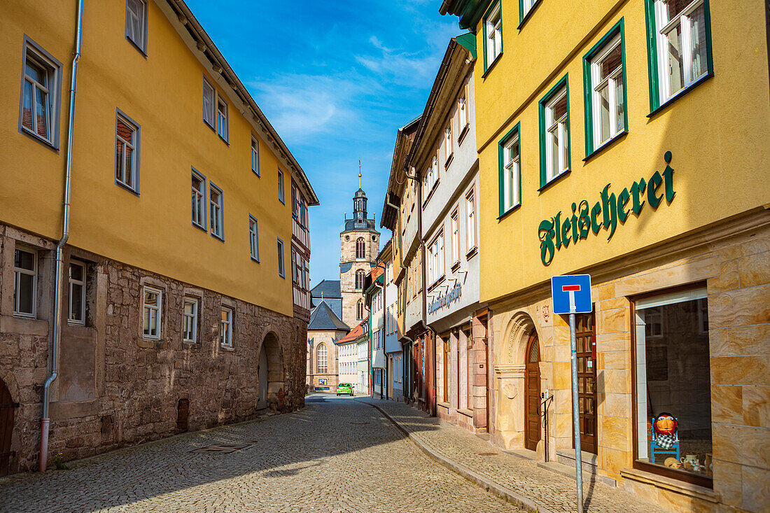 Kirchstrasse with a view of St. Johannis in Schleusingen, Thuringia, Germany