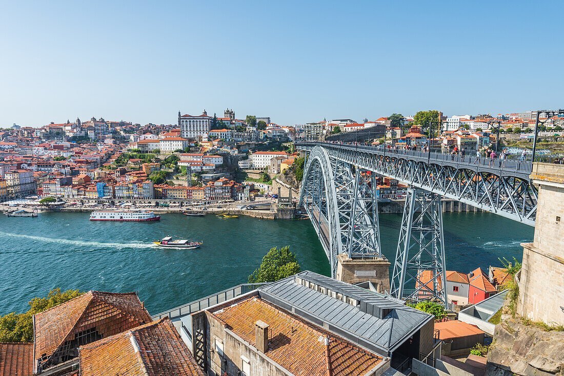 Dom Luís I truss arch bridge over Douro river and historic old town in Porto, Portugal