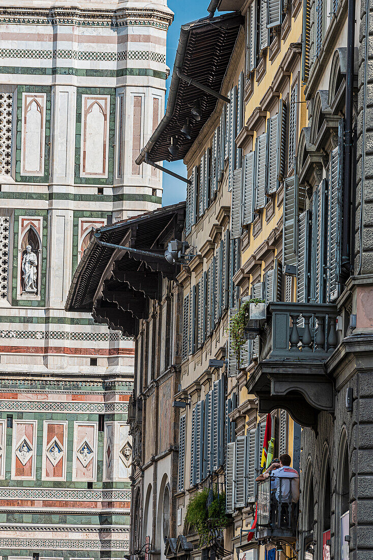 Houses with balconies in front of the facade of the Duomo, Duomo Santa Maria del Fiore, Duomo, Cathedral, Florence, Tuscany, Italy, Europe