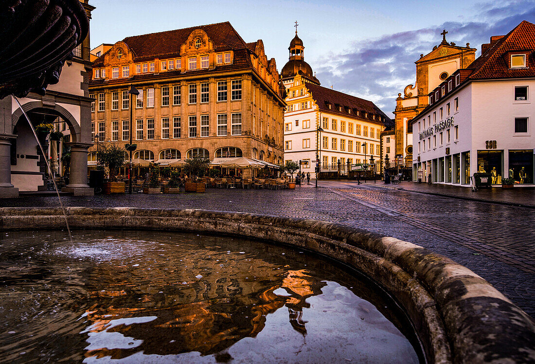 View from the fountain in front of the town hall to the Marktkirche and the Theodorianum in Paderborn, North Rhine-Westphalia, Germany