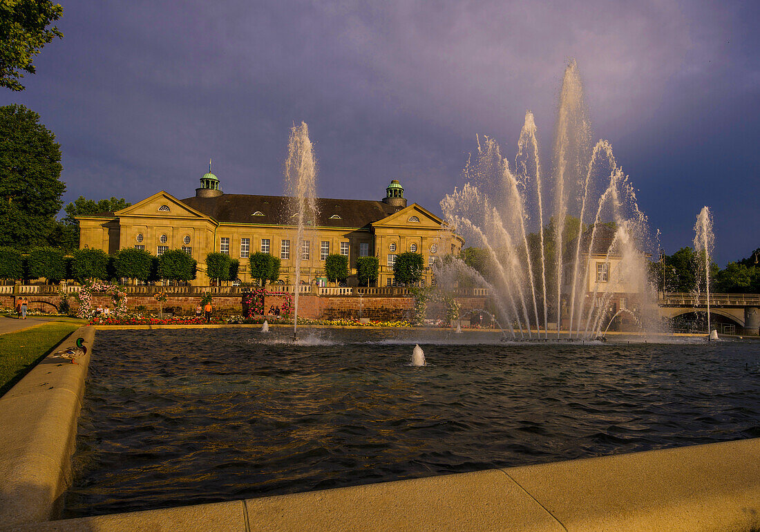 Fountains in the rose garden of Bad Kissingen with a view of the Regentenbau, Bavaria, Germany