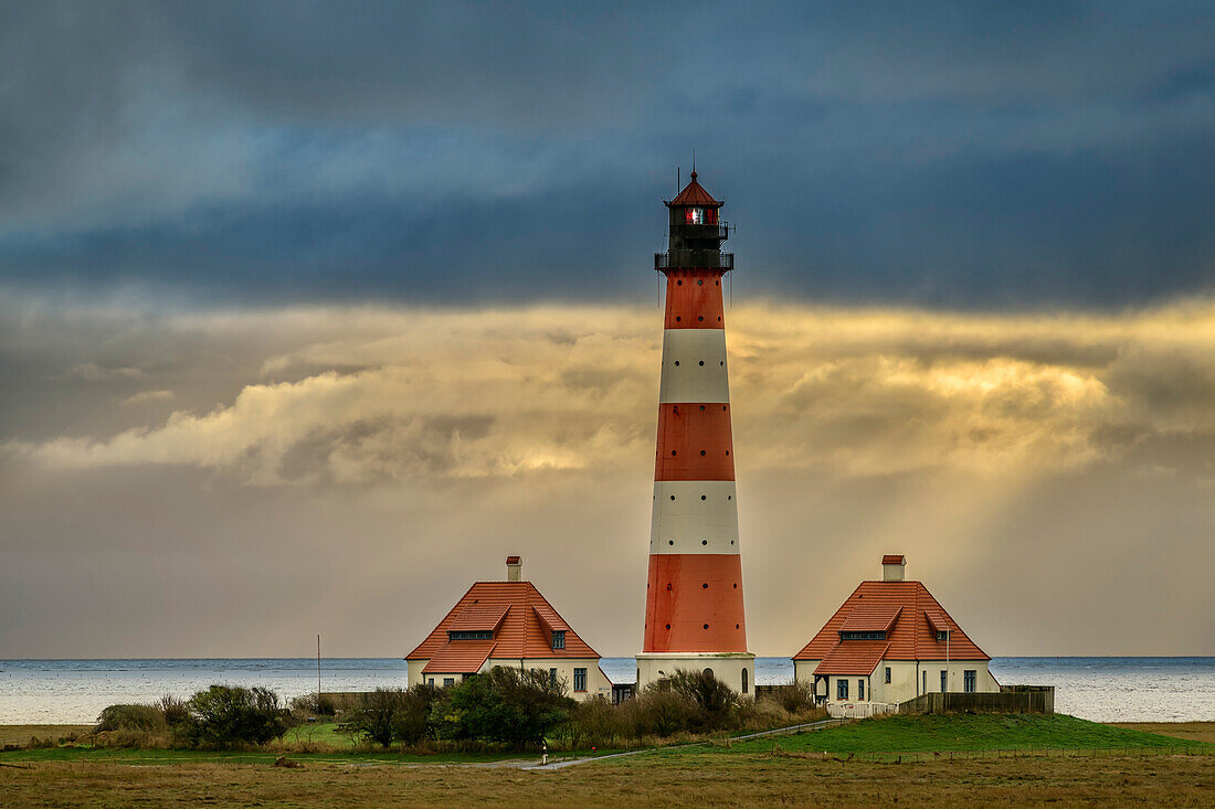 Cloud mood over the Westerhever lighthouse, Westerheversand, Westerhever, Wadden Sea National Park, Schleswig-Holstein, Germany