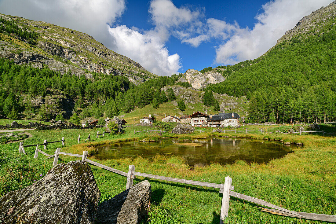 Pond with alpine settlement Le Monal, Rutor Group, Graian Alps, Savoy, Savoie, France