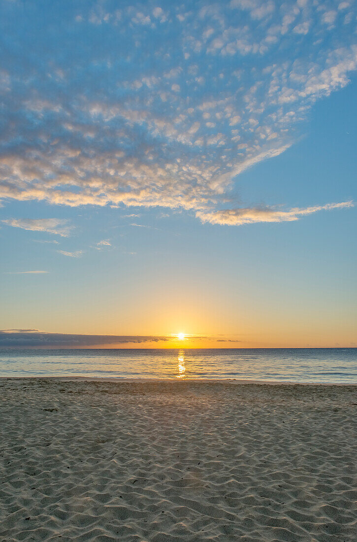 Sun setting over Wailua beach, Kauai, USA