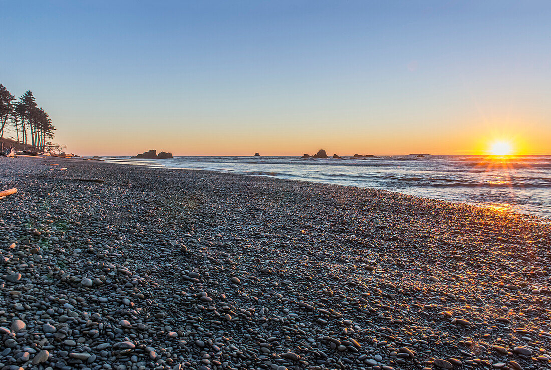 Ruby Beach in Olympic National Park with sun setting over ocean, USA