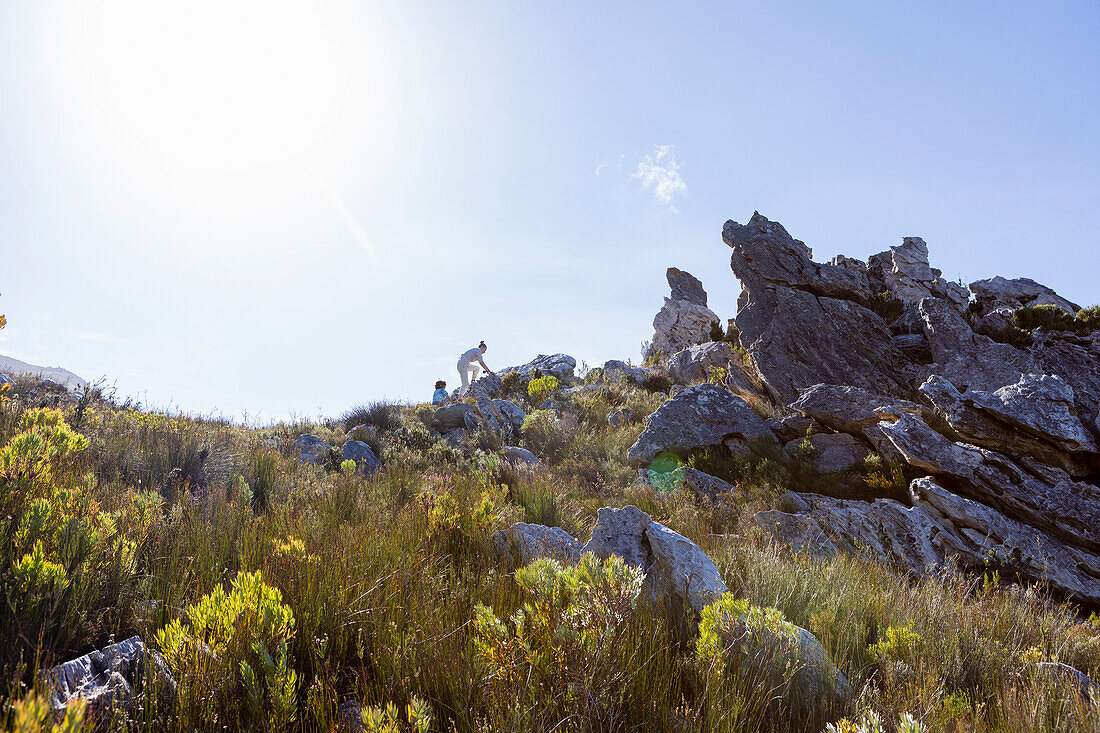 Family hiking a nature trail, Phillipskop nature reserve, Stanford, South Africa.