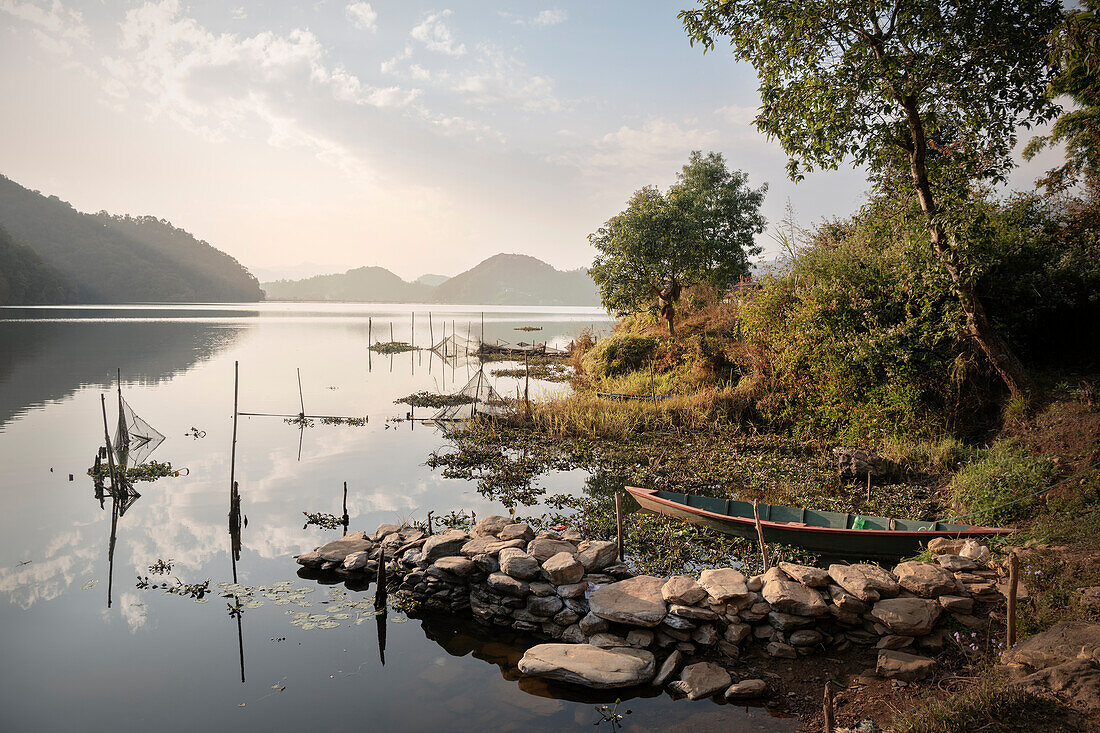 Boat and fishing nets at Lake Begnas Tal, Lekhnath near Pokhara, Nepal, Himalayas, Asia