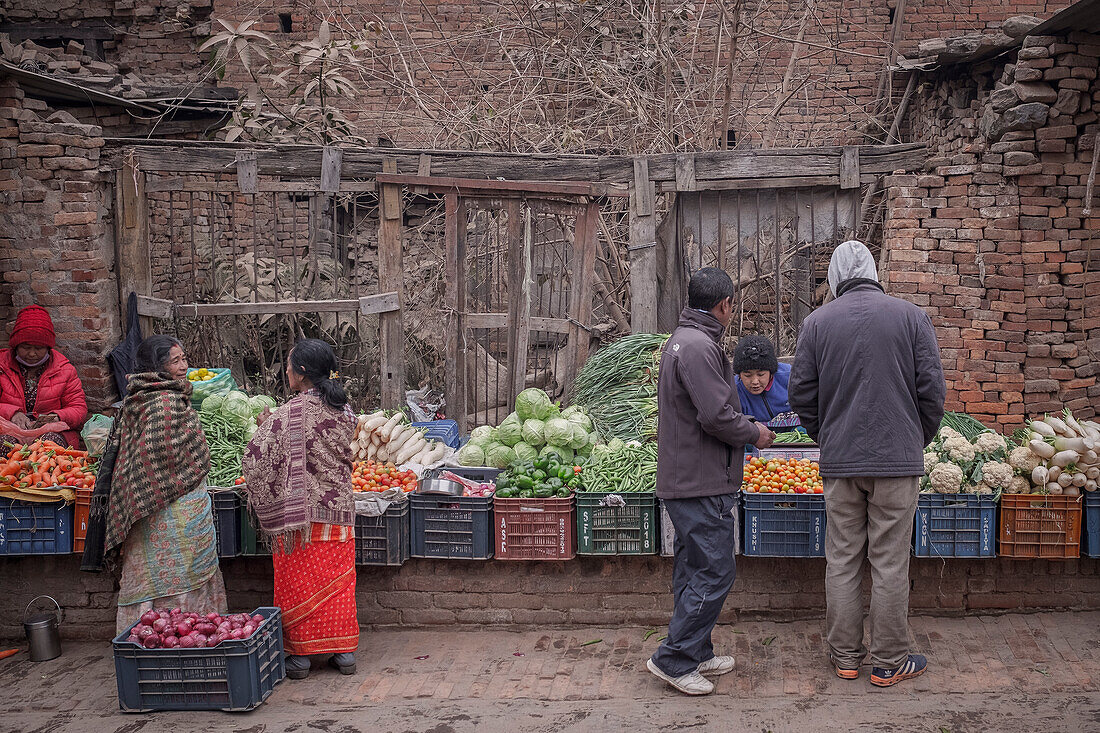 Colorful vegetable market in front of ruins destroyed by earthquakes, Bhaktapur, Lalitpur, Kathmandu Valley, Nepal, Himalaya, Asia, UNESCO World Heritage Site