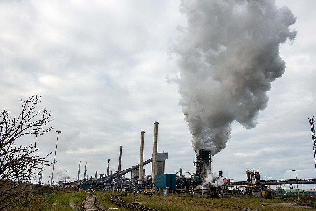 IJmuiden,Netherlands. Huge,heavy steel production plant and industry terrain,producing various kinds of steel inside an CO2 emitting factory. The steel plant is called Hoogovens and is owned by Tata Steel,an international corporation,who also suffers from decline in revenues and ever increasing demands on corporate responsibility,regarding labour and climate.