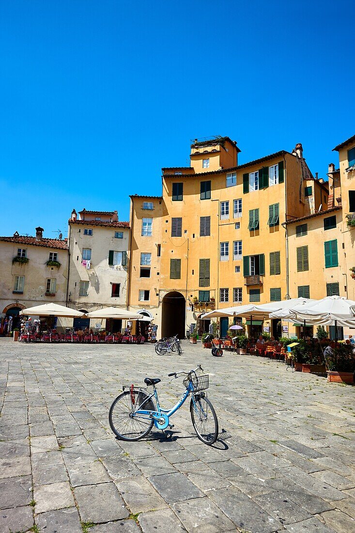 Bicycles in the Piazza dell'Anfiteatro inside the ancinet Roman ampitheatre of Lucca,Tunscany,Italy.