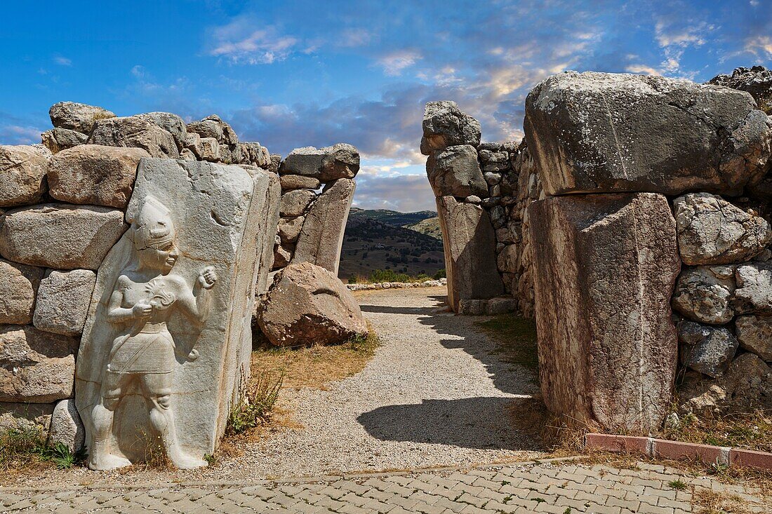 Hittite Relief sculpture of the God of War of the Kings Gate. Hattusa (or Hattusas) late Anatolian Bronze Age capital of the Hittite Empire. Hittite archaeological site and ruins,Bogazkale,Turkey.