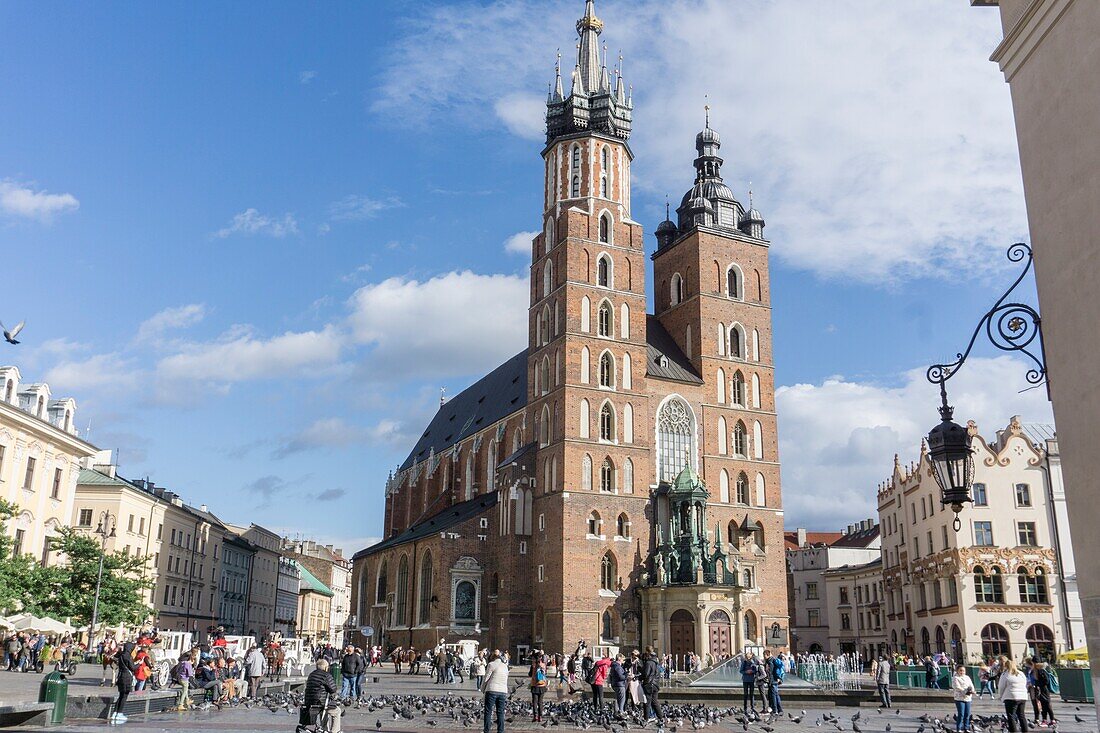 KRAKOW POLAND ON SEPTEMBER 24,2018: The main square of the Old Town of Krakow with St Mary gothic cathedral,Lesser Poland.