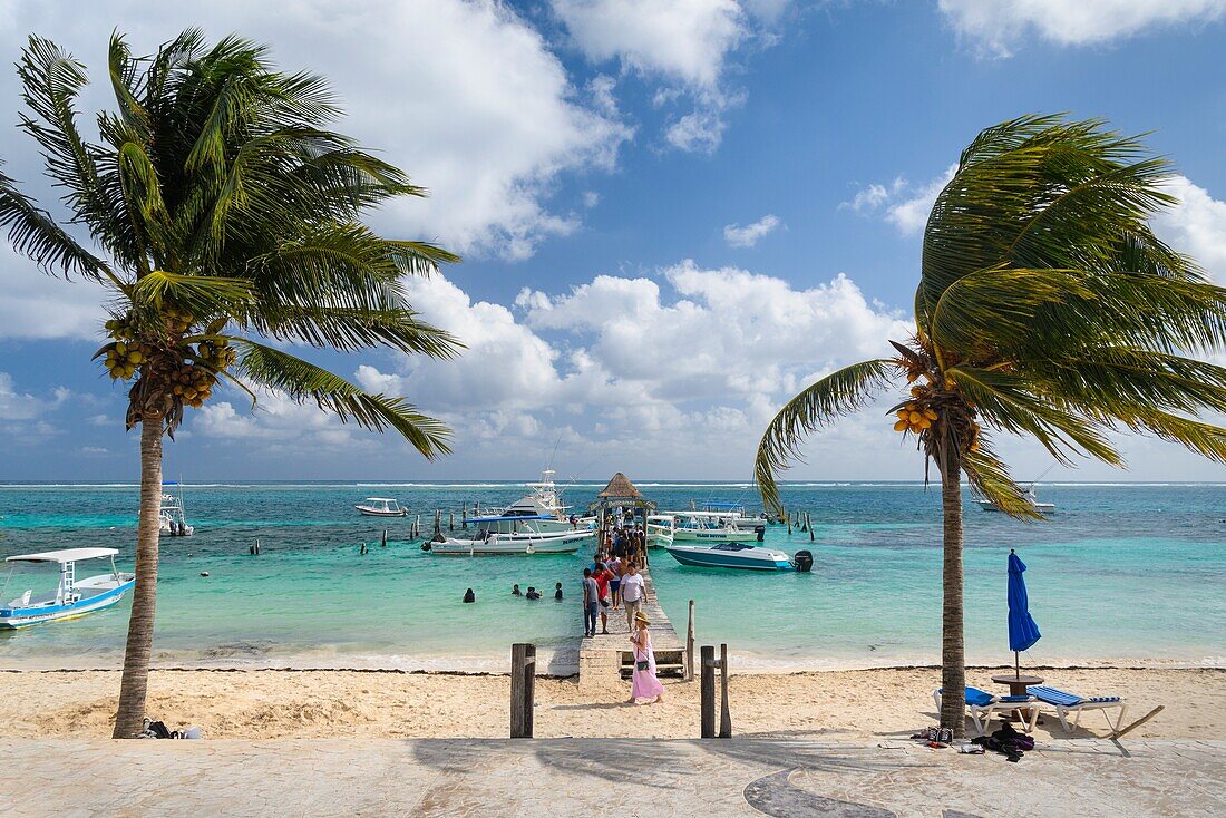 The malecon and Pelicanos Yacht Club pier in Puerto Morelos,Riviera Maya,Mexico.