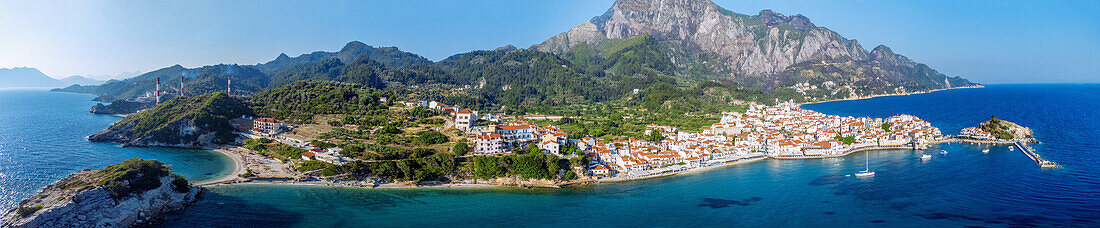 Kokkari, aerial view of sunrise beach, old town and harbor with offshore rocky islands on Samos island in Greece