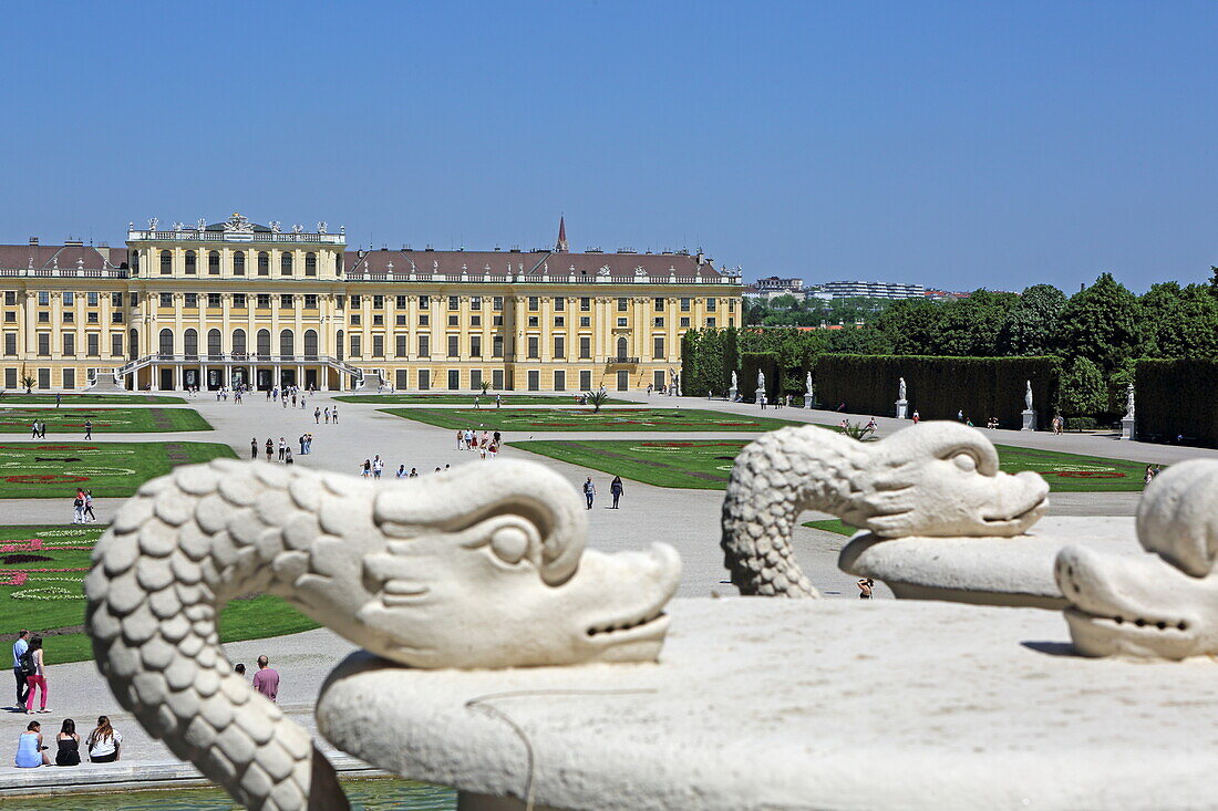 Figures of the Neptune Fountain with Schönbrunn Palace, Vienna, Austria