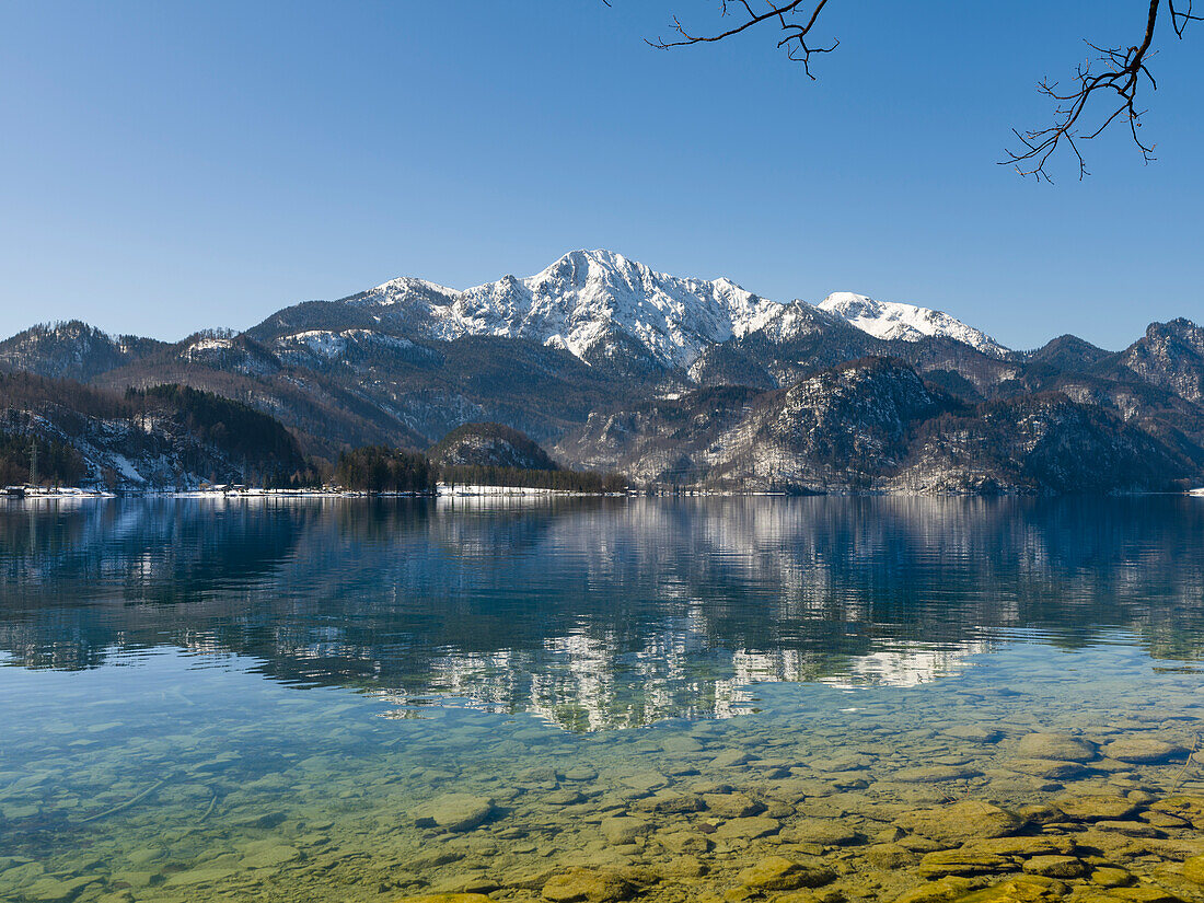 Lake Kochelsee at village Kochel am See during winter in the Bavarian Alps. Mt. Herzogstand in the background. Germany, Bavaria