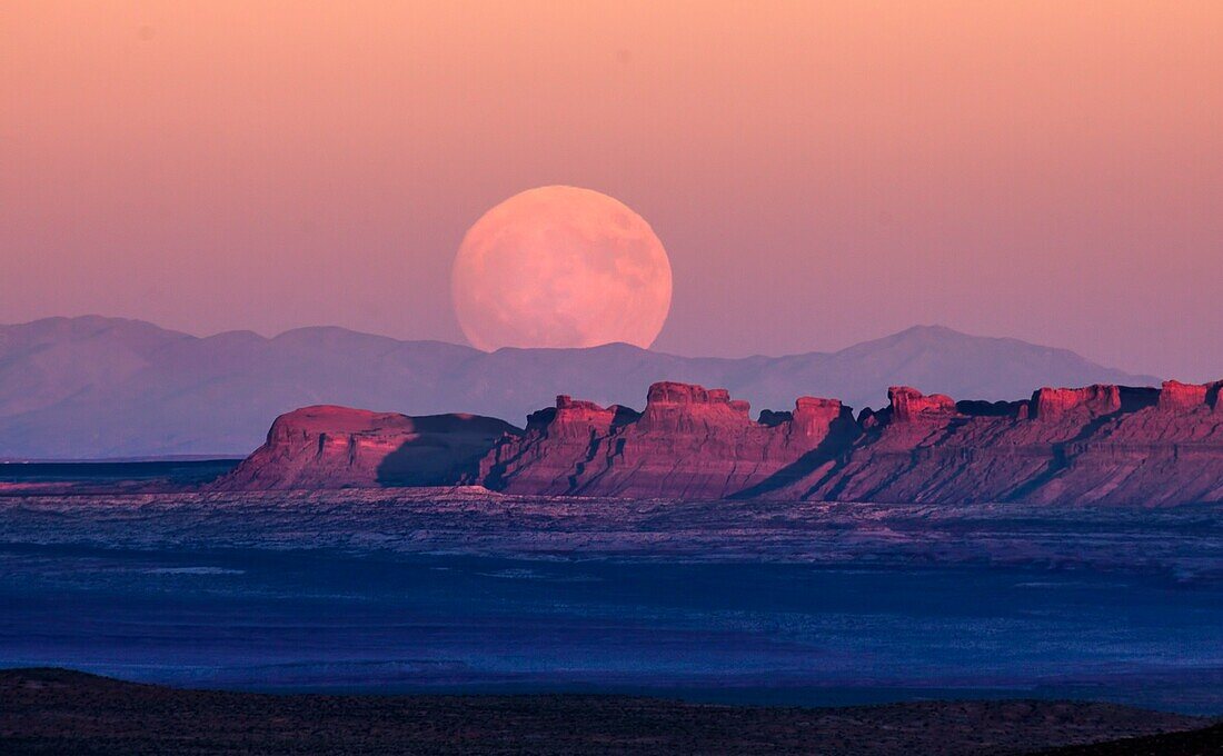 The full moon or supermoon rises over Monument Valley on Navajo Tribal Land on the Utah/Arizona border.