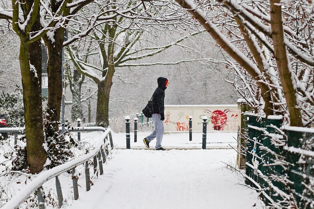 A pedestrian after a heavy snowfall during winter in Berlin,Germany.