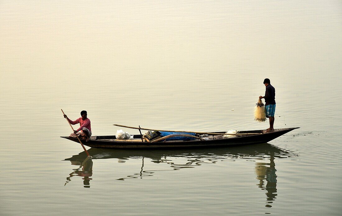 Guwahati,Assam,India. January 30,2019. Fishermen lays their fishing net at the Brahmaputra River during sunset.