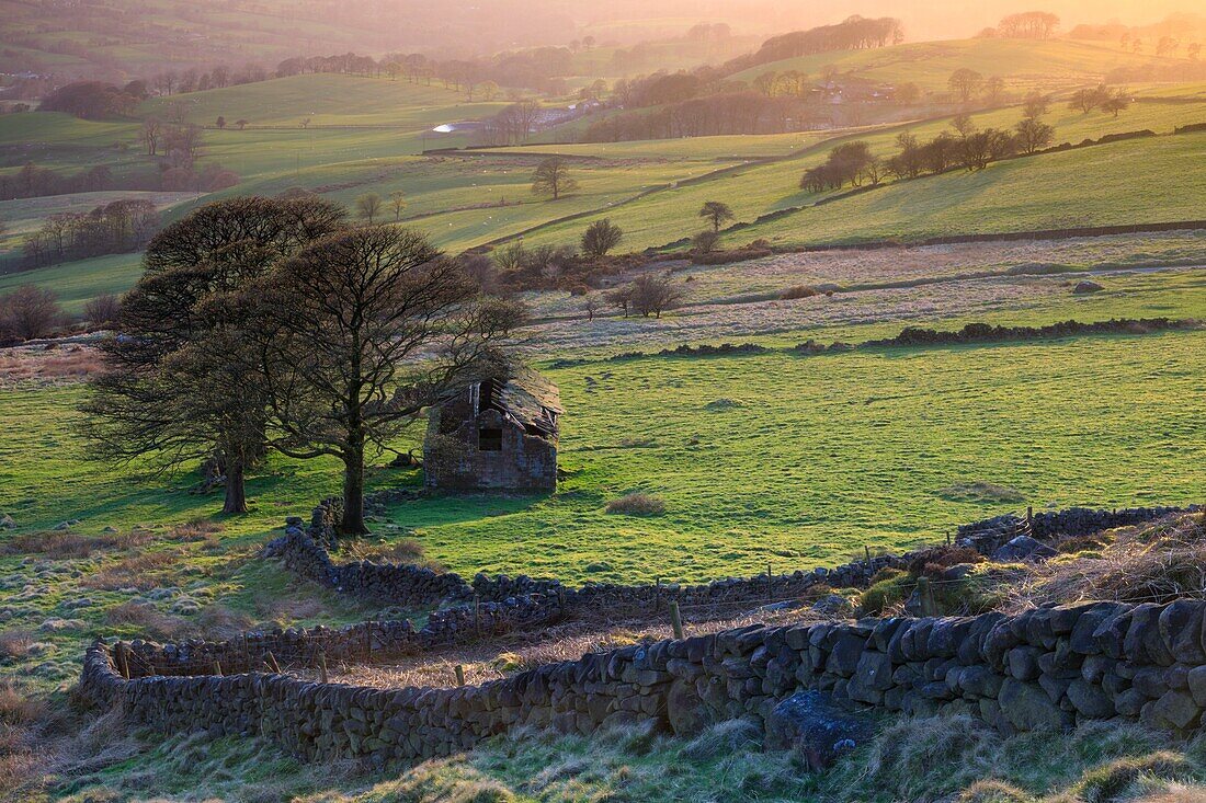 The barn at Roach End in the Peak District National Park captured from a high vantage point on an evening in late April.