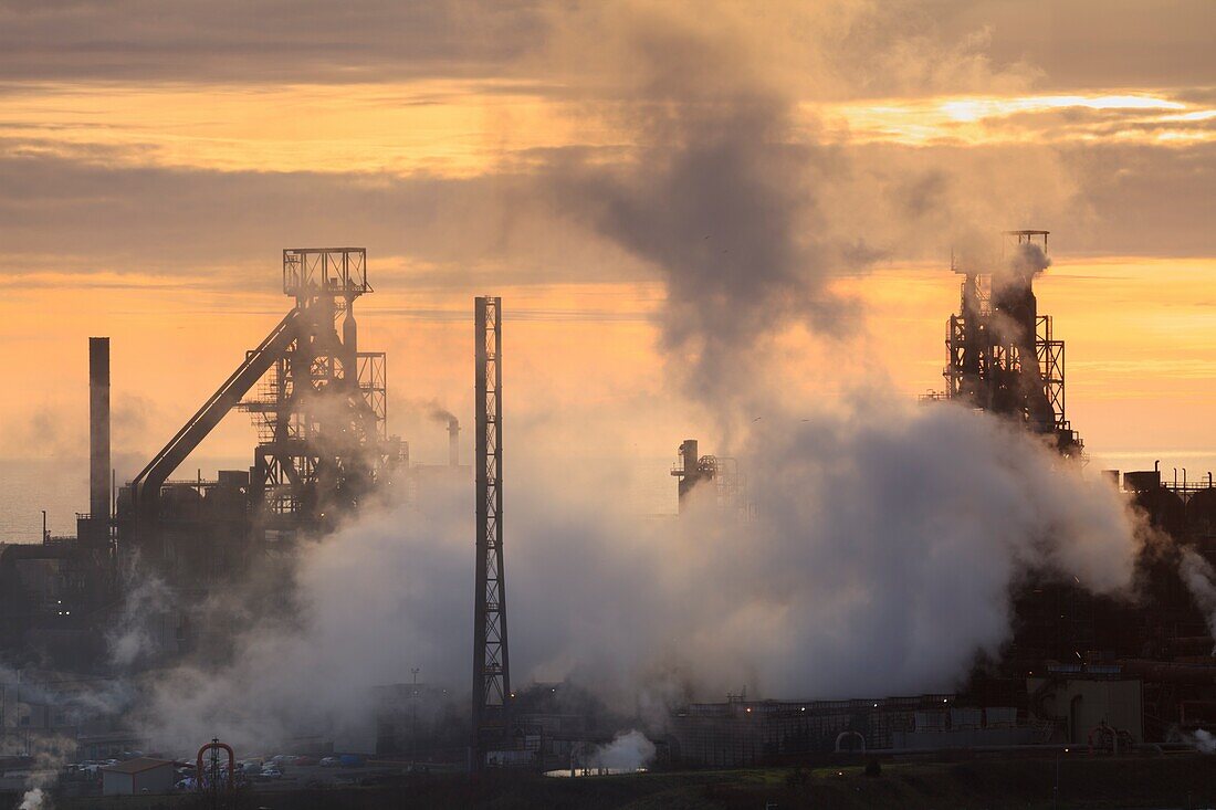 The Tata Steelworks at Port Talbot,in South Wales,captured at sunset from an inland section of the Wales Coast Path on an evening in mid February.