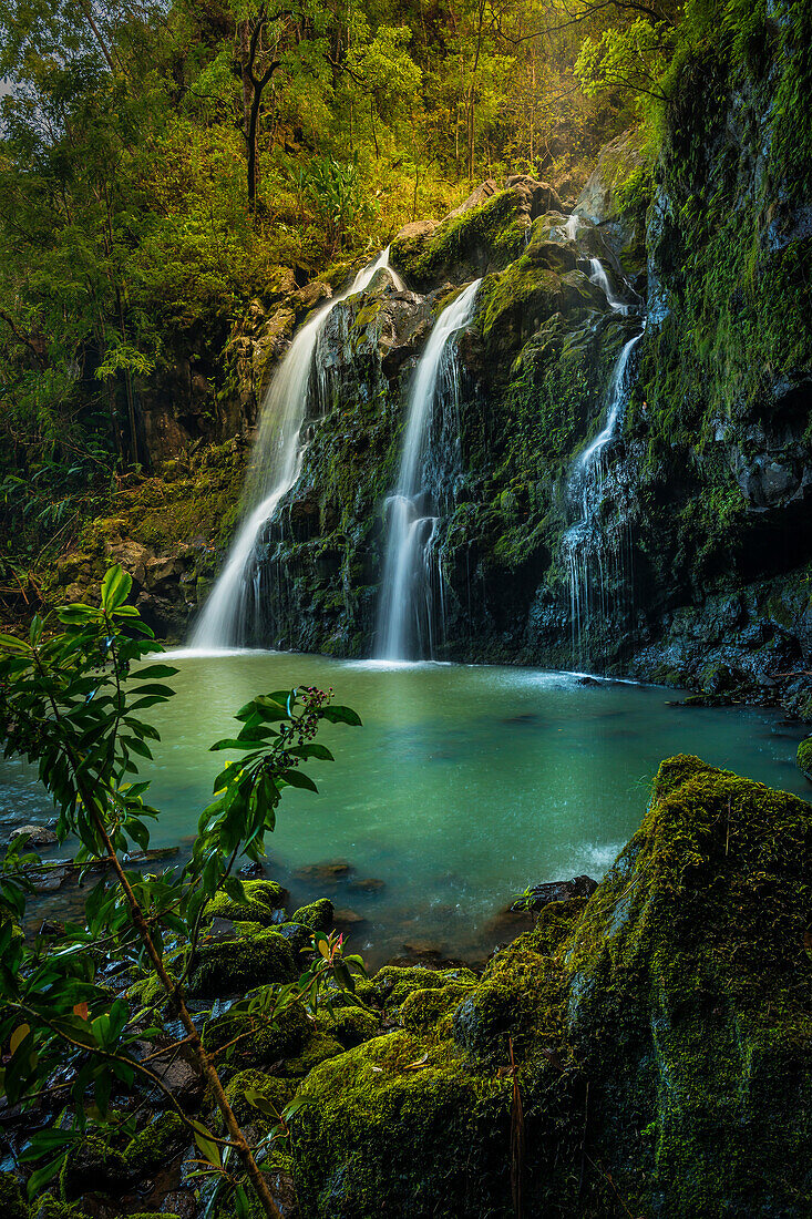 Upper Waikani Falls (Three Bears Falls) in soft sunset light catching early evening mist, Maui, Hawaii, United States of America, Pacific