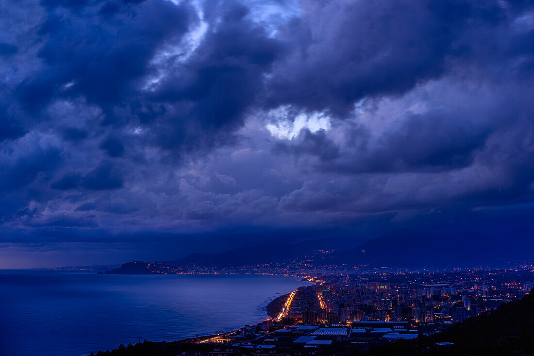 Threatening storm clouds over nighttime Alanya, Turkish Riviera, Mediterranean region, Asia Minor, Turkey