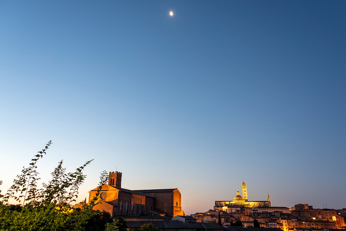 Siena Cathedral, Santa Maria Assunta, to the left Basilica di San Domenico, above the moon, Siena, Tuscany, Italy